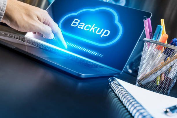 Businessman hand using modern laptop with Cloud Backup concept | Fusion Arc Hosting